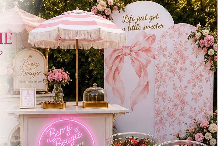 Berry Bougie pink and gold luxury dessert cart with neon sign at an event